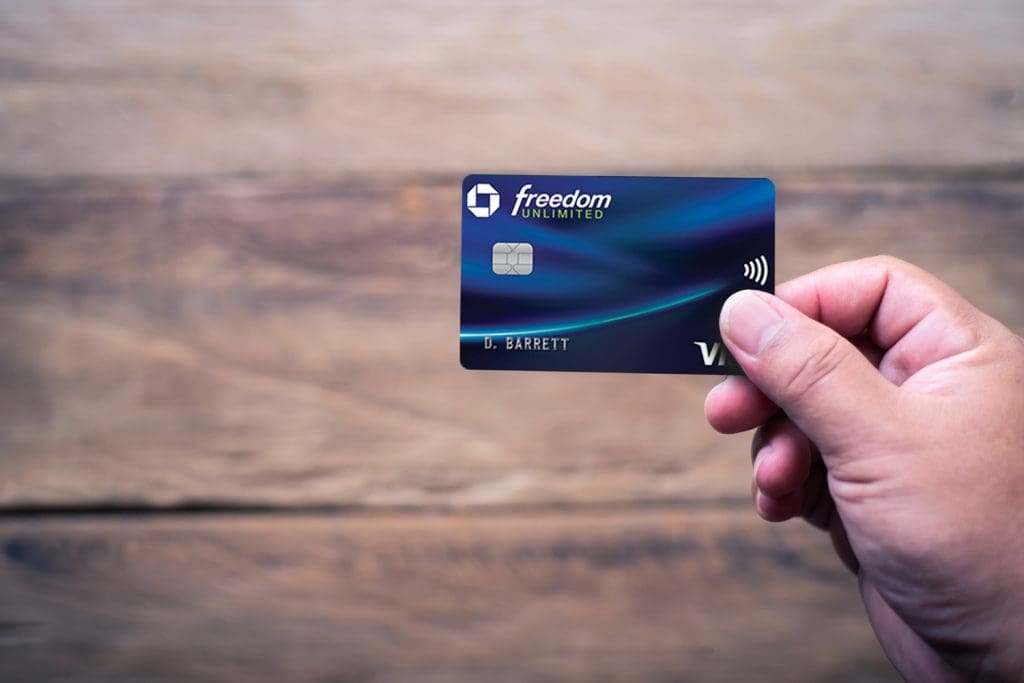 Hand holding the Chase Freedom Unlimited Credit Card